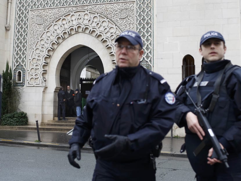 French police stand in front of the entrance of Paris Mosque as French Muslims gather for Friday prayers in Paris January 9, 2015, two days after gunmen stormed weekly satirical newspaper Charlie Hebdo in Paris.  Photo: Reuters