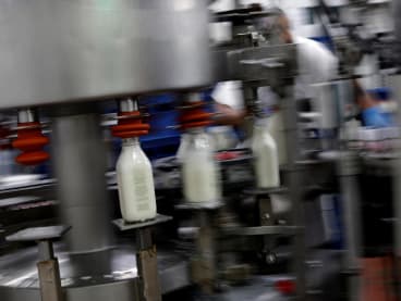 Bottles of milk are been processed at the South Mountain Creamery farm in Middletown, Maryland US, on May 19, 2020.