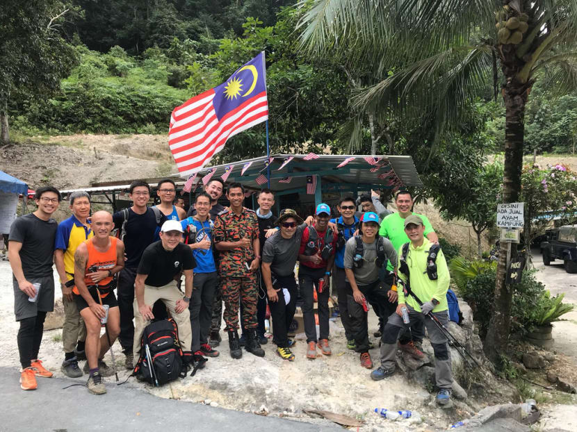 Volunteers from Singapore and Malaysia posing for photos after receiving news that the missing Singaporean trekkers have been found on Thursday (Feb 8 ) morning. Photo courtesy of: Stanley Ler