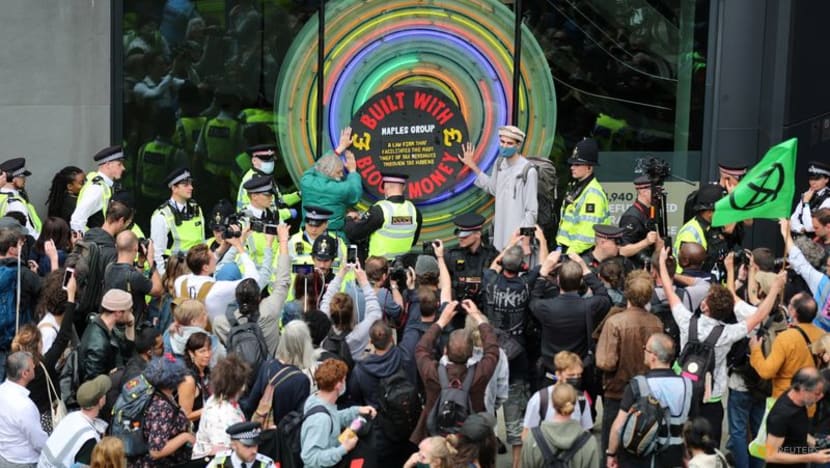 Climate activists deface City of London buildings in intensifying campaign Climate activists deface City of London buildings in intensifying campaign