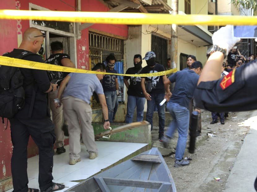 Police officers search a house after a raid in Bandung, West Java, Indonesia, Friday, May 26, 2017. Indonesian police arrested three suspected militants Friday for their alleged involvement in twin suicide bombings that killed three people in Jakarta, while the Islamic State group claimed it was responsible for the attack. Photo: AP