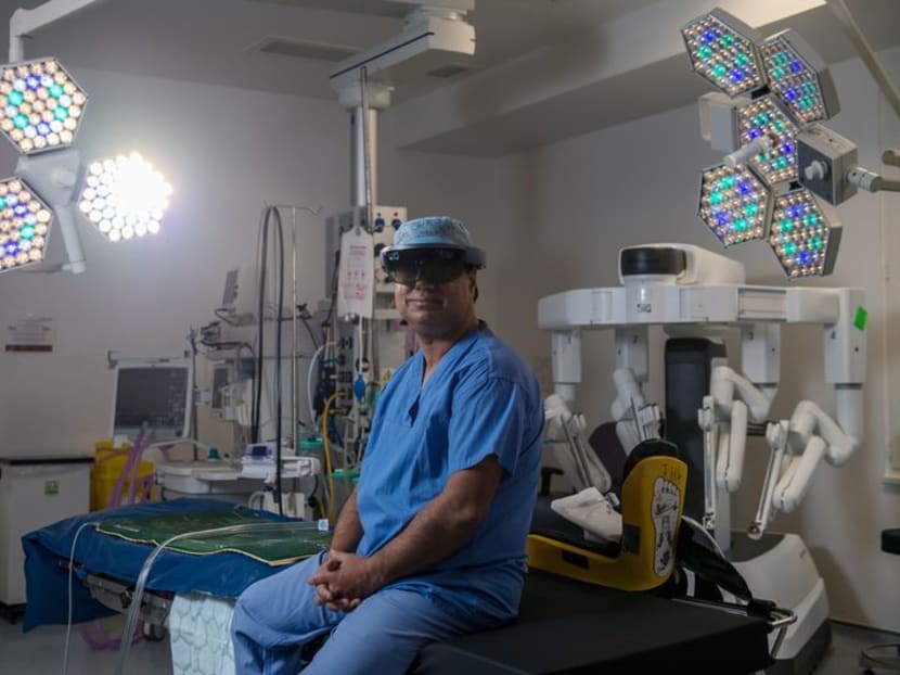 Dr Shafi Ahmed, a British colorectal surgeon wears the Microsoft HoloLens inside his operating theater. Photo: Bloomberg
