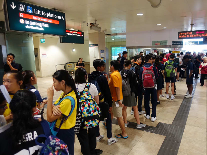 A long queue at Bishan MRT Station as students and commuters wait to get excuse slips from station staff, after signalling faults disrupted the Downtown and North-South lines during morning rush hour, on Aug 18, 2017. Photo: Koh Mui Fong/TODAY