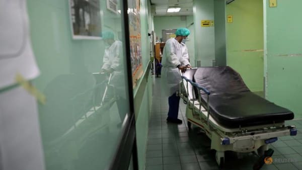 https://onecms-res.cloudinary.com/image/upload/s--lft3iDmj--/f_auto,q_auto/c_fill,g_auto,h_338,w_600/a-health-worker-wearing-a-protective-suit-arranges-hospital-bed-at-emergency-department-in-the-kuala-lumpur-hospital--amid-the-coronavirus-disease--covid-19--outbreak--in-kuala-lumpu-3.jpg?itok=bxSfQzNc