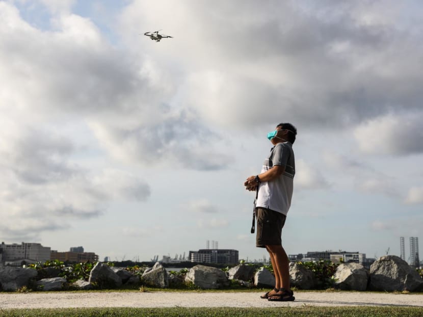 An enthusiast flying a drone at the unmanned aircraft flying area at Pandan Reservoir on July 17, 2022.