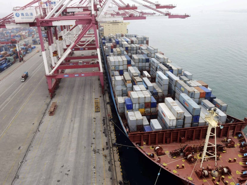 A ship is docked at a container port in Qingdao in eastern China's Shandong province on July 8, 2013. Photo: AP