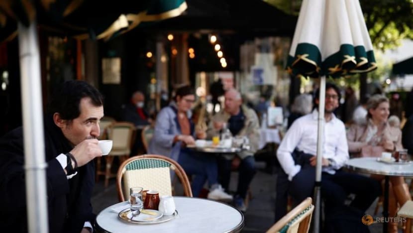 Parisians tuck into coffee and croissants again as cafes re-open