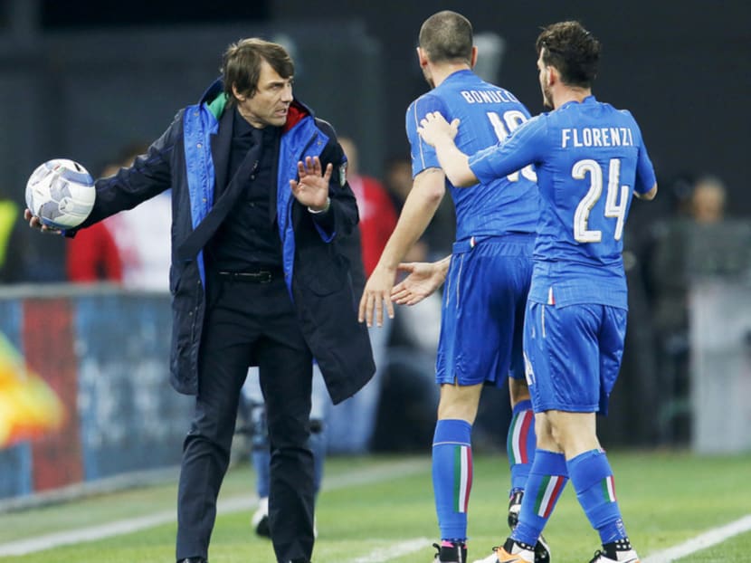 In Italy, Antonio Conte (left) is known as a martello — a hammer — because he pounds away at his players and never stops.