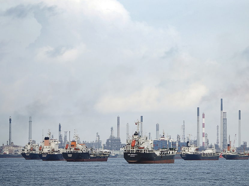 Ships are seen anchored in front of a refinery on Singapore's Bukom Island. About a quarter of the world's seaborne oil trade passes through the Malacca Strait, a choke point on the route between the Middle East and the energy-hungry economies of East Asia. Reuters file photo
