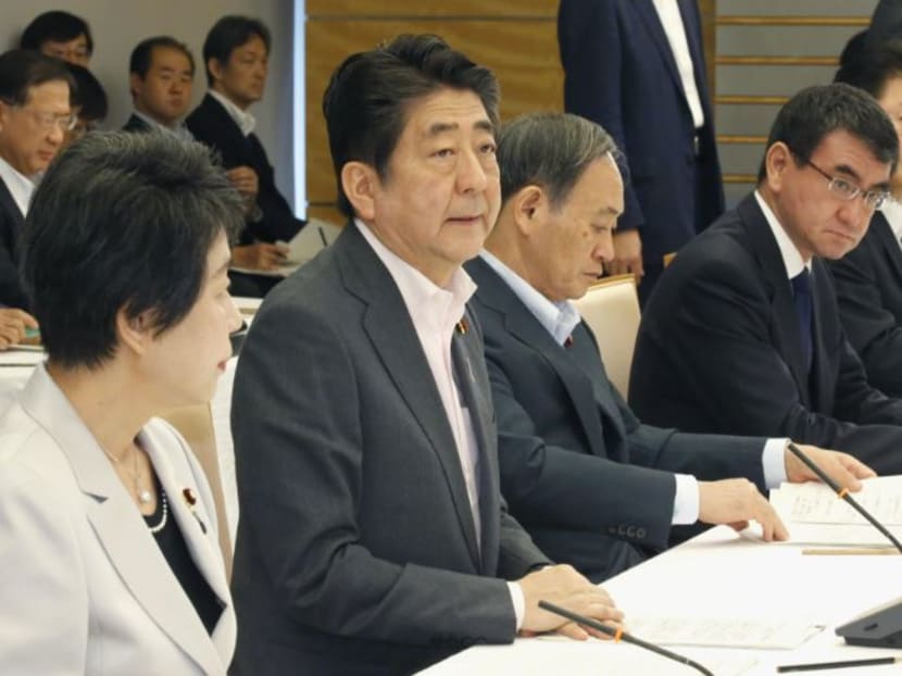 Prime Minister Shinzo Abe (2nd from L) speaks during a ministerial meeting in Tokyo about a plan to accept more foreign workers. Prime Minister Shinzo Abe (2nd from L) speaks during a ministerial meeting in Tokyo about a plan to accept more foreign workers.