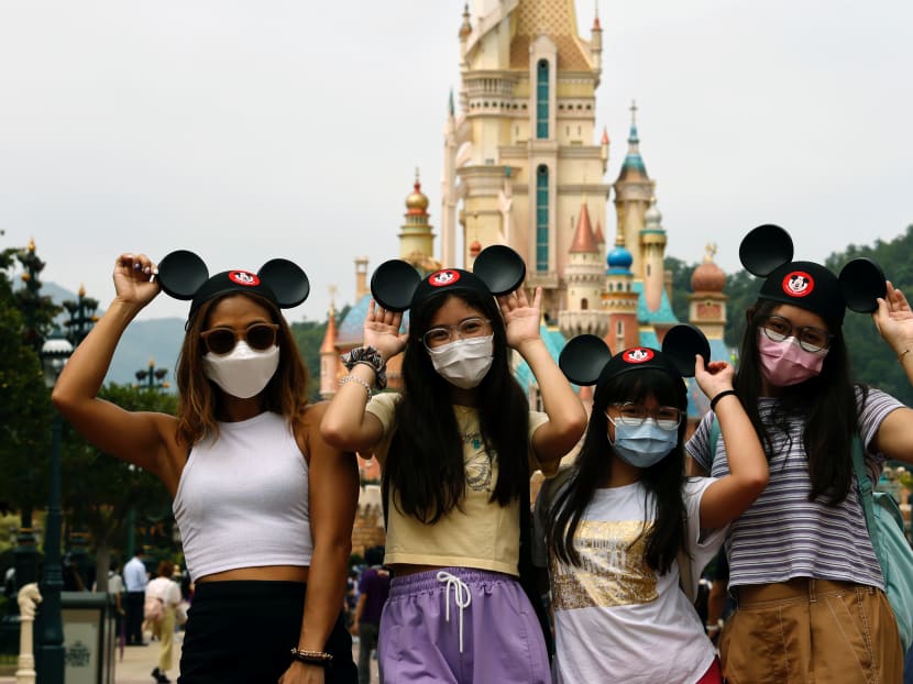 Visitors posing at Disneyland theme park in Hong Kong when it reopened on Sept 25, 2020. Under an upcoming travel bubble, Singaporeans will be able to visit Hong Kong regardless of the type of travel involved.