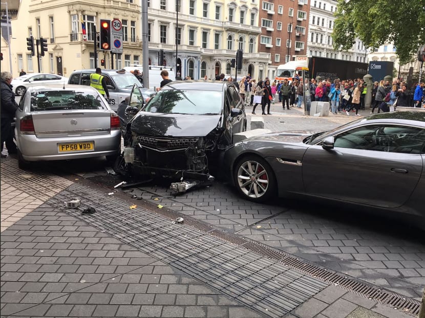 A handout picture obtained from the twitter user @StefanoSutter shows damaged vehicles on Exhibition Road, in between the Victoria and Albert (V&A) museum, and the Natural History Museum, in London on October 7, 2017, following an incident in South Kensington. Photo: @StefanoSutter/AFP