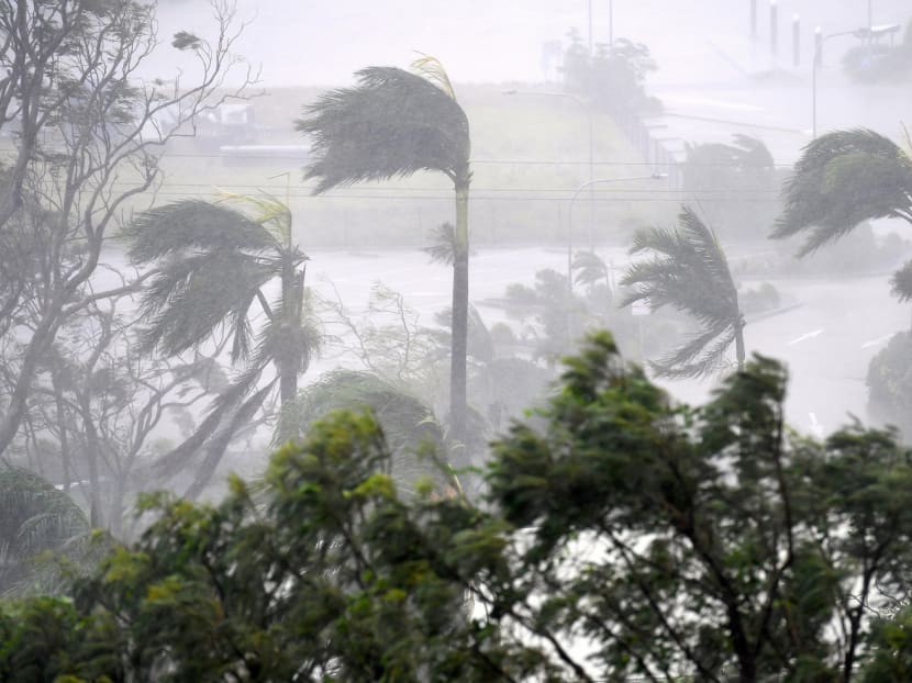 Tens of thousands forced to flee their homes as cyclone slams into Queensland