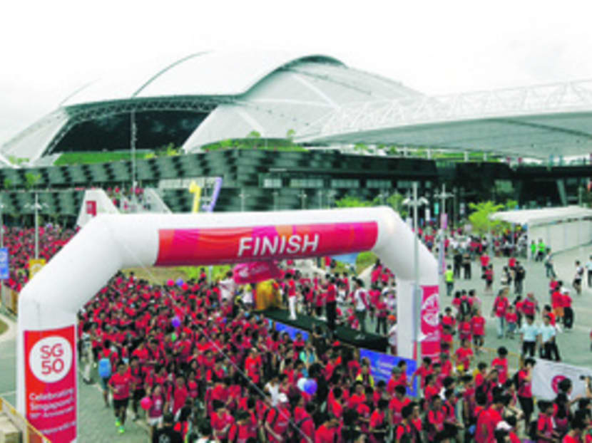 Participants setting off in a walk-a-Jog at the Singapore Sports Hub during a countdown celebration to usher in the 28th SEA Games which will be held in Singapore next year.