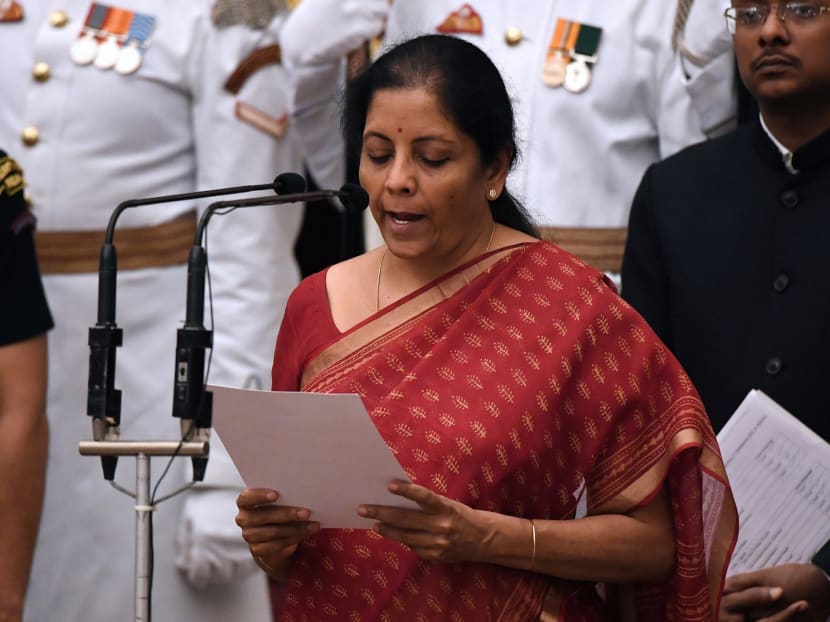 Defence Minister Nirmala Sitharaman taking the oath during the swearing-in ceremony of new ministers at the Presidential Palace in New Delhi on Sunday. Photo: Reuters
