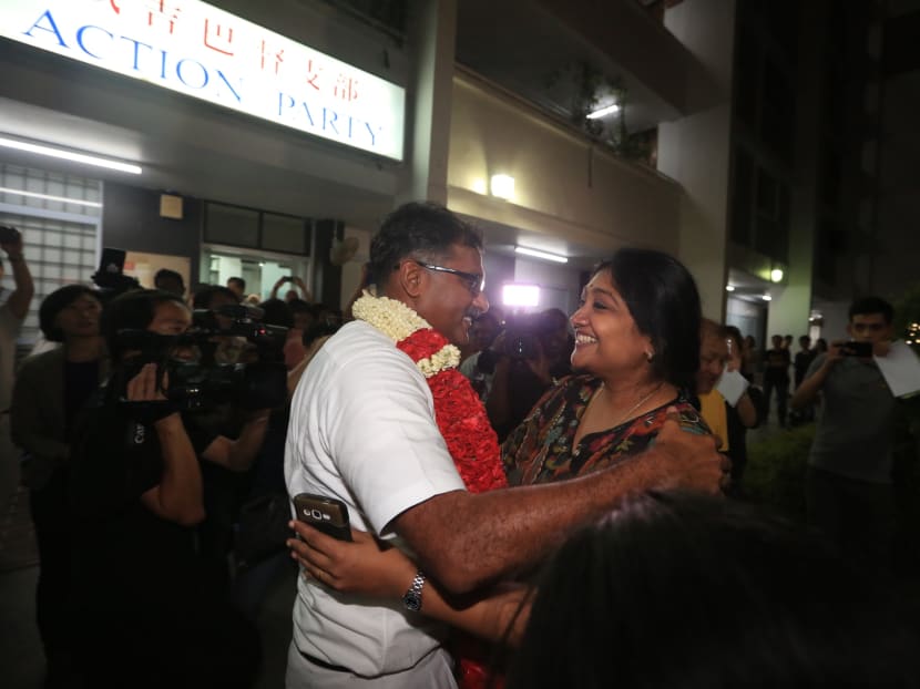 Mr Murali hugs his wife after the by-election results are announced on May 7, 2016. Photo: Koh Mui Fong