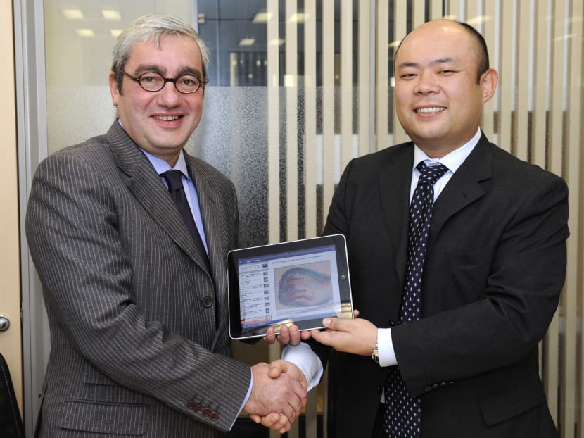 Taizo Son (right), Japan's Internet guru, seen here with AFP Chairman Emmanuel Hoog in a file photo from 2010.  Photo: AFP