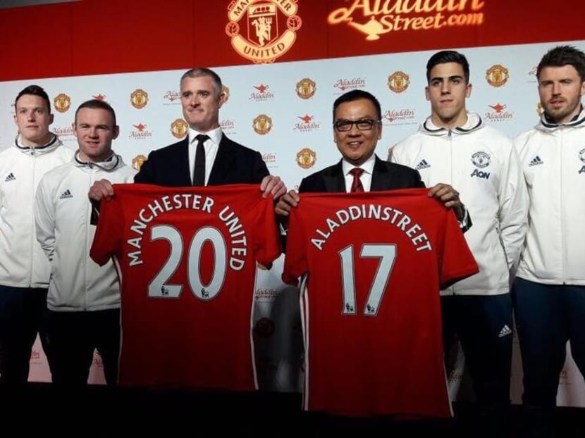 Aladdin Group co-founder and president Dato' Sri Desmond To (right) with Manchester United group managing director Richard Arnold and United players during the global partnership launch. Photo: Aladdin Street Singapore