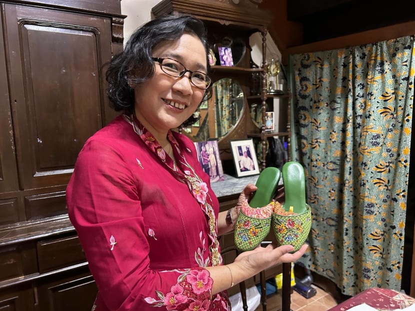 Katong Antique House volunteer Angeline Kong gives tours and