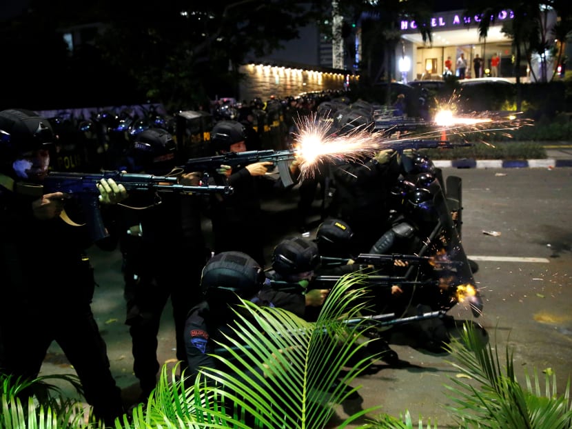 Photo of the day: Mobile brigade (Brimob) police officers open fire during a clash with locals in Jakarta, Indonesia, May 22, 2019.