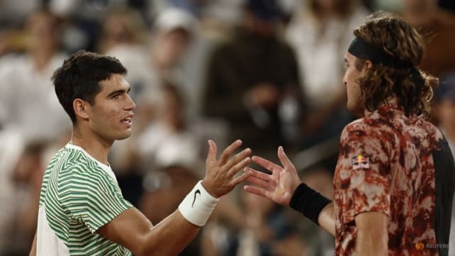 Top seed Alcaraz hunts down Tsitsipas to set up Djokovic showdown