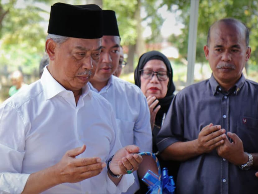 Malaysian PM Muhyiddin Yassin visiting the grave of his father, mother and family in Muar on March 2, a day after he was sworn in.