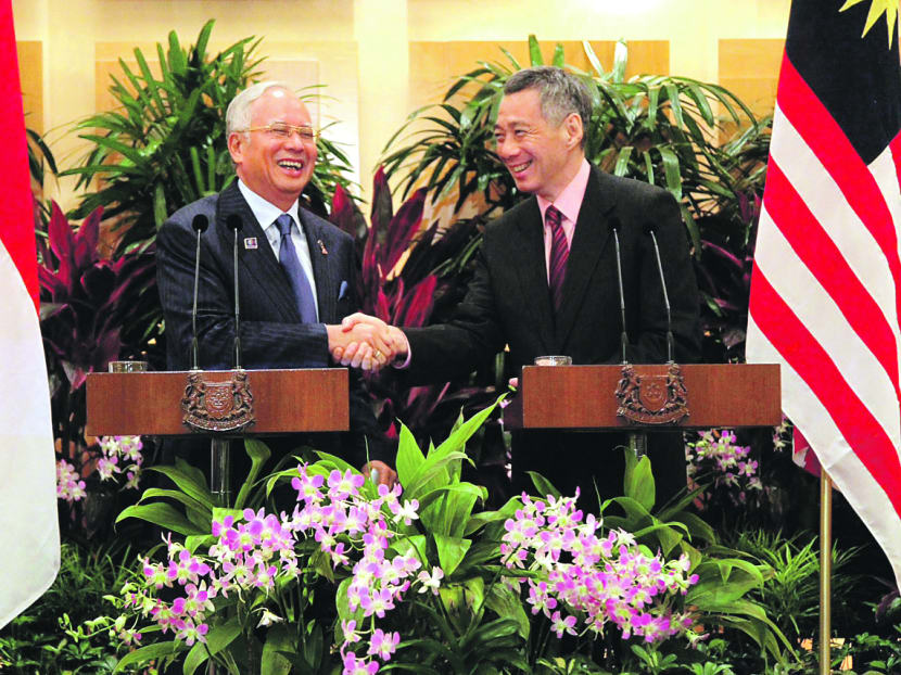 Malaysian Premier Najib Razak and PM Lee Hsien Loong affirming their warm ties during a press conference at the Singapore-Malaysia Leaders’ Retreat yesterday. Photo: Don Wong