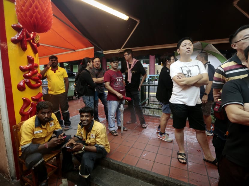 For S$5 an hour, migrant workers queue overnight for bak kwa