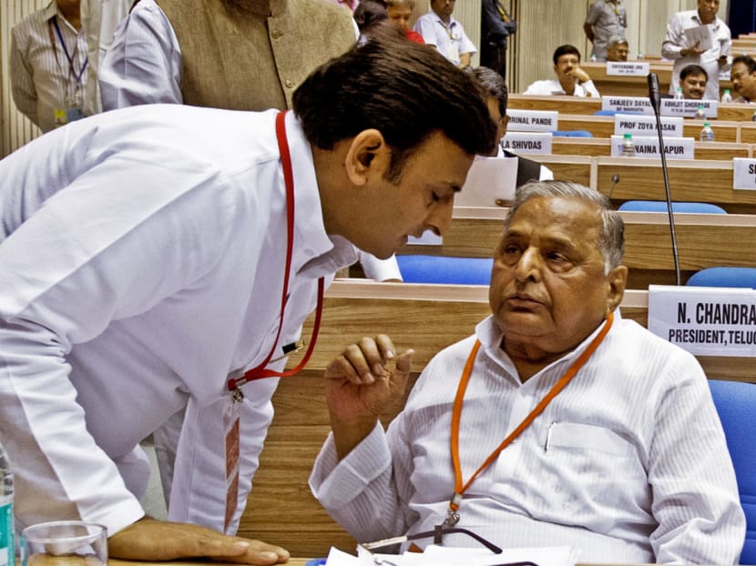 Uttar Pradesh Chief Minister Akhilesh Yadav (left) and his father Mulayam Singh Yadav in a picture taken in 2013. The 43-year-old Mr Akhilesh has been trying to assert his authority by publicly admonishing the older man and sacking an uncle. Photo: AFP