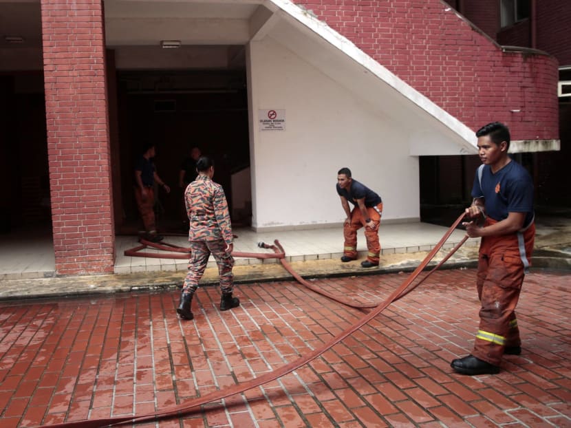 Firefighters in the aftermath of a fire at JB's Sultan Aminah Hospital on Oct 25, 2016. Photo: Jason Quah/TODAY
