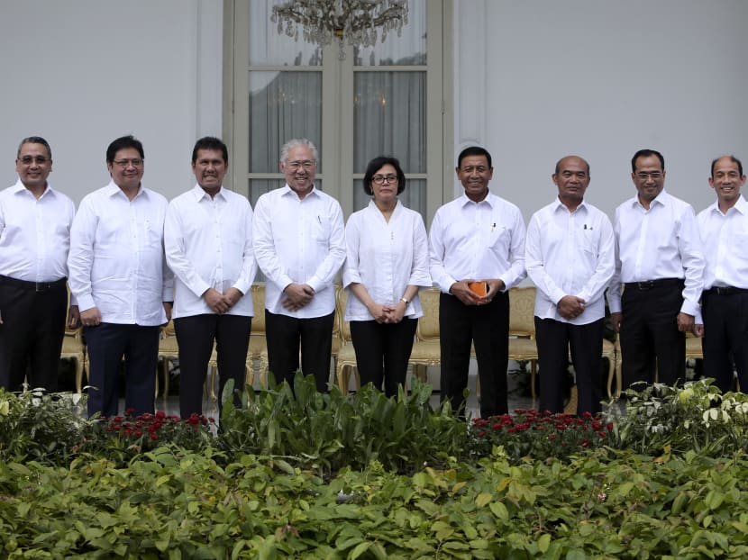 Indonesia's new cabinet ministers pose for photographers during the announcement of the new cabinet line-up at Merdeka Palace, Wednesday, July 27, 2016. Photo: AP