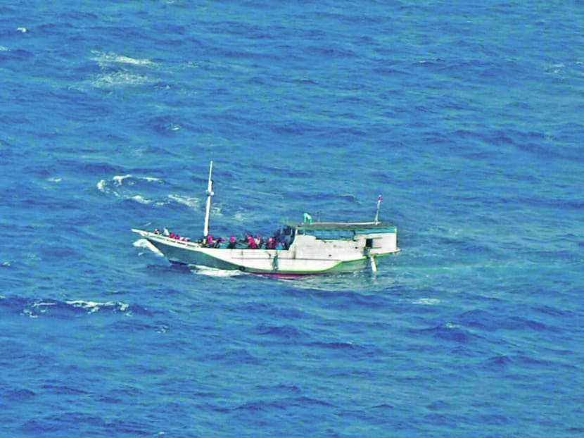 In this July 4, 2012 file photo released by the Indonesian National Search And Rescue Agency, a wooden boat which is believed to have up to 180 asylum seekers on board floats on the waters off Christmas Island, Australia. Photo: AP