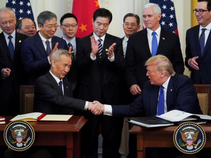 Chinese Vice-Premier Liu He and US President Donald Trump shake hands after signing "phase one" of the US-China trade agreement at the White House in Washington.