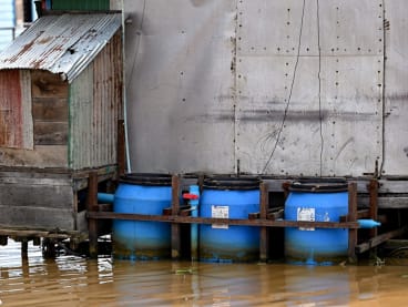 This photo taken on March 13, 2023 shows floating toilets in Chong Prolay village on Tonle Sap lake in Siem Reap province. 