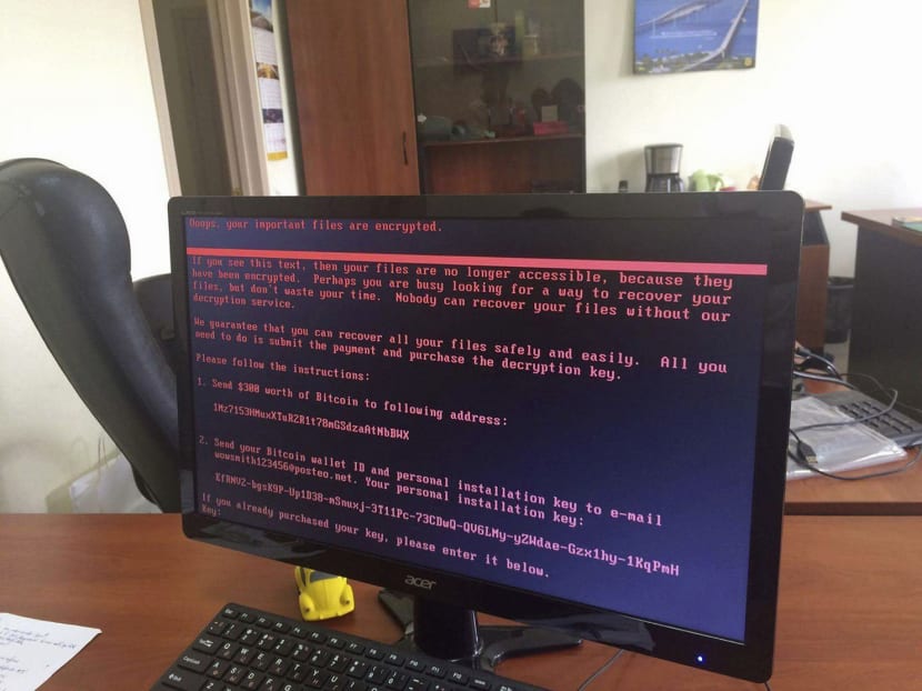 A computer displaying a warning notice, after a cyber attack at an office in Ukraine on Tuesday. Experts said the malware that hit computers  was similar to a virus called Petya, which was first identified last year. The attack was judged by some experts to be more dangerous as it could spread across networks via a single affected computer. Photo: AP