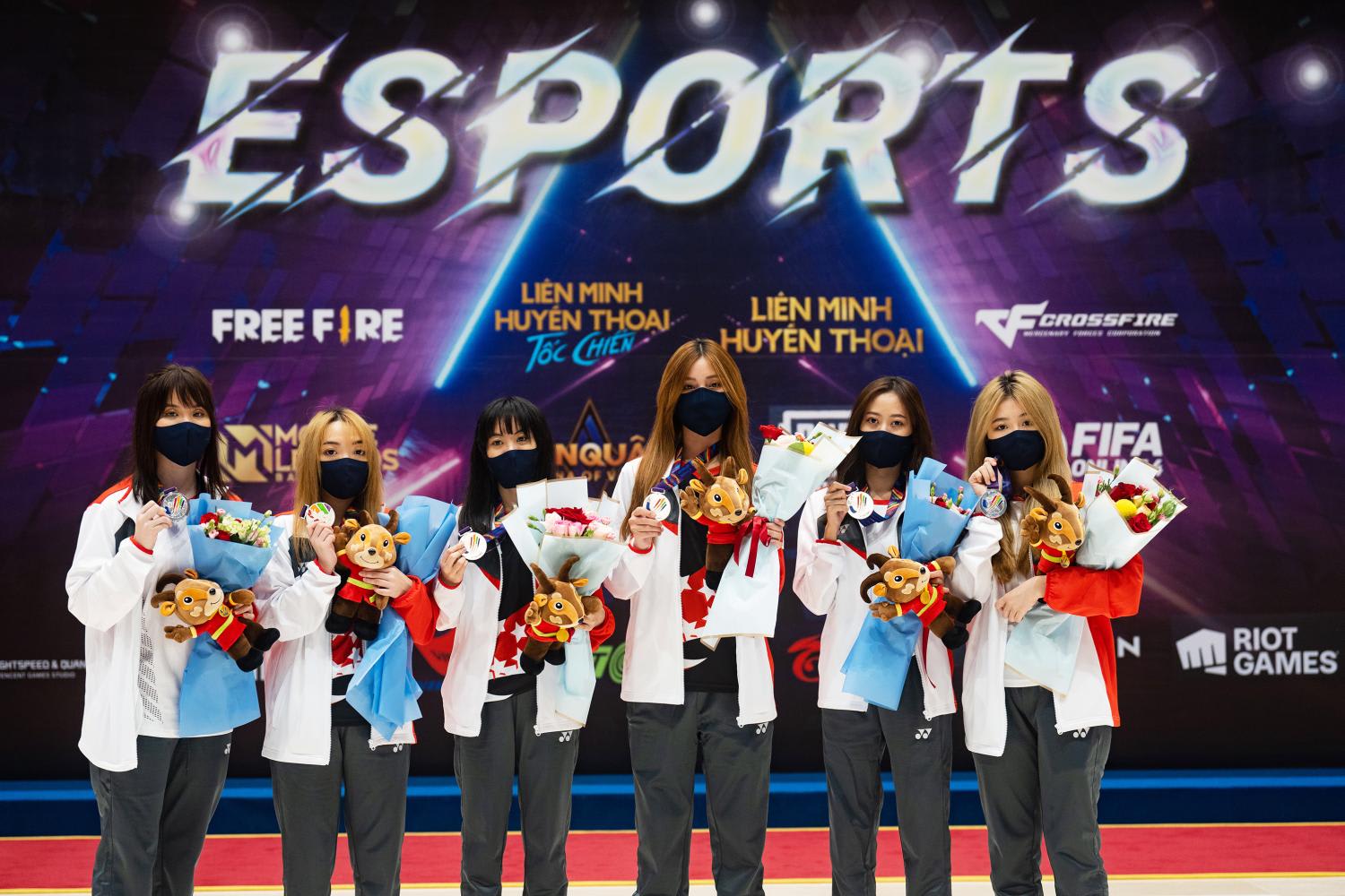 <span><span>Ms Jolene ‘Lustreless’ Poh (left most) and Team TSL clinched the silver medal in the League of Legends: Wild Rift (mobile) event for Singapore at the Hanoi SEA Games on May 18, 2022.&nbsp; </span></span>