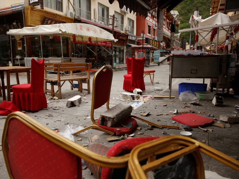 Chairs and pieces of the facade are scattered outside a restaurant in a tourist street after an earthquake in Jiuzhaigou, Sichuan province, China, August 10, 2017.  Photo: Reuters
