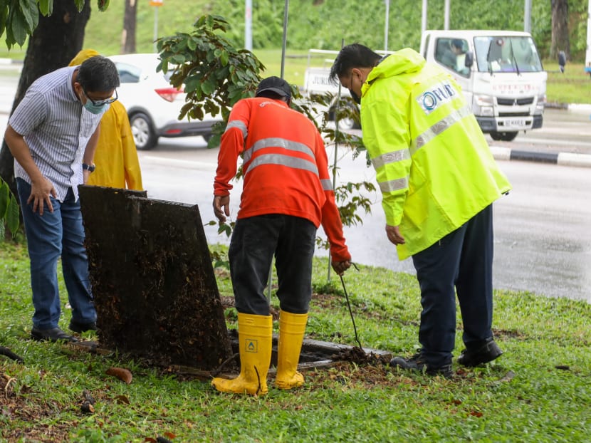 PUB's response team looking into drains after a flash flood at the junction of Tampines Ave 10 and Pasir Ris Drive 12 on Aug 20, 2021. PUB's response team looking into drains after a flash flood at the junction of Tampines Ave 10 and Pasir Ris Drive 12 on Aug 20, 2021.