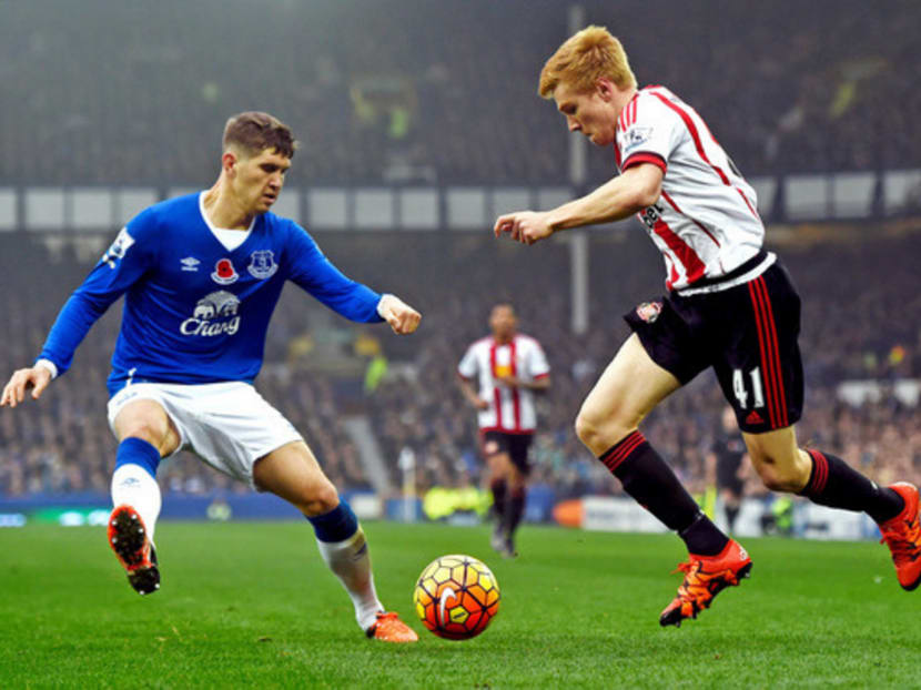 Duncan Watmore (right) of Sunderland taking on John Stones on Nov 1. Barcelona are continuing to monitor Stones’ progress. Photo: Getty Images
