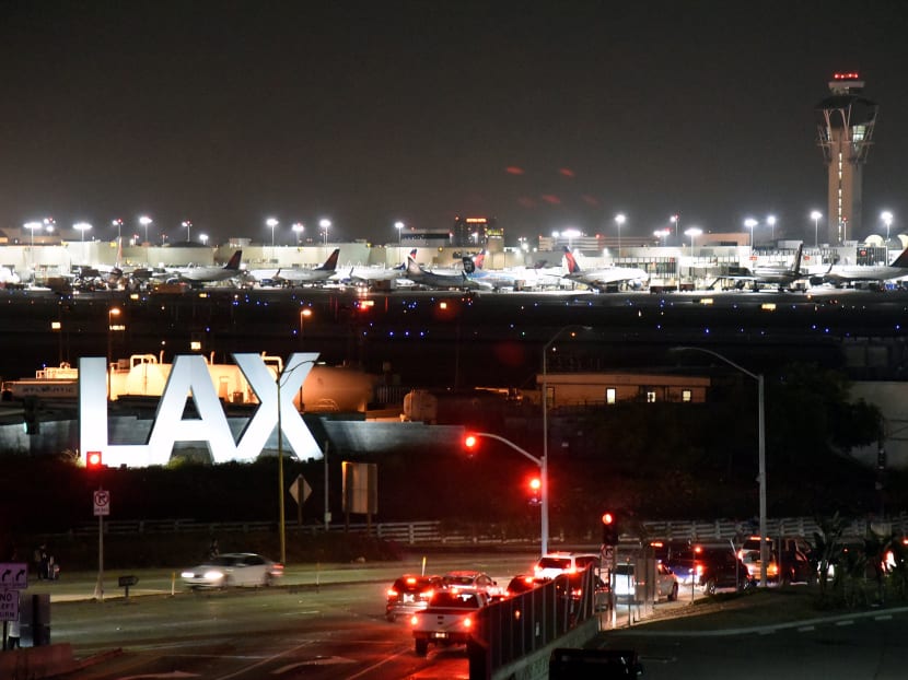Traffic near the LAX sign, as terminals at Los Angeles International Airport were evacuated briefly late on Aug 28, following a false alarm. Photo: Reuters