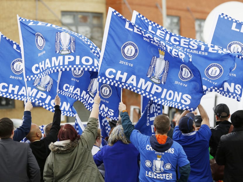 Once this season is over, and Leicester fans (above) are no longer surfing bubbles, we will learn whether it was a one-off or the start of an era. The concern is that predators further up the fame chain might buy out PFA Player of the Year nominees Jamie Vardy, N’Golo Kante and winner Riyad Mahrez. Photo: Reuters