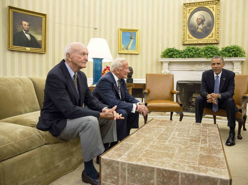 US President Barack Obama meets with Apollo 11 Astronauts Buzz Aldrin (centre) and Michael Collins (left) to commemorate the 45th anniversary of the Apollo 11 mission in the Oval Office at the White House in Washington July 22, 2014.  Photo: Reuters