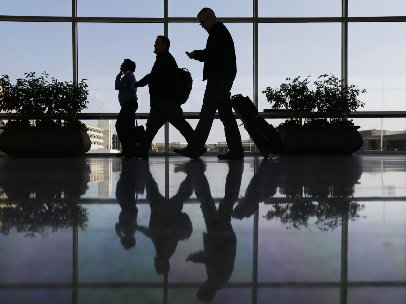 In this Feb 14, 2013 file photo, travellers pass through a corridor at Philadelphia International Airport in Philadelphia. Photo: AP