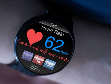 A person's heart rate at rest being displayed on a smartwatch. 