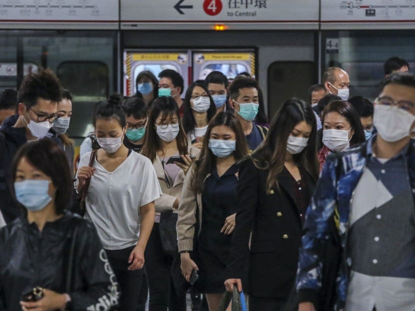 Commuters wearing masks at Admiralty station in Hong Kong.