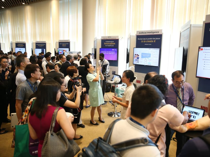 Guests viewing the National HealthTech Challenge booths where new concepts and prototypes for HealthTech innovations are displayed at the National Health IT Summit (NHITS) 2018.