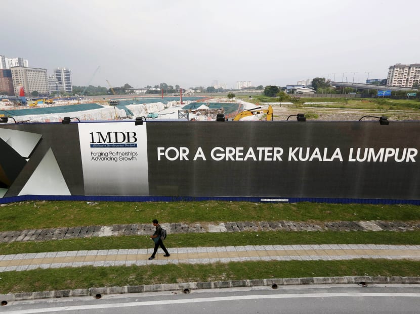 A 1Malaysia Development Berhad (1MDB) billboard at the funds flagship Tun Razak Exchange development in Kuala Lumpur, in a 2015 file photo. Possible witnesses to the alleged looting of billions of dollars from 1MDB have told the government they’re worried about putting “the safety and security of both themselves and their families at serious risk”, the FBI said on Tuesday (Sept 5) in a federal court filing in Los Angeles. Reuters file photo