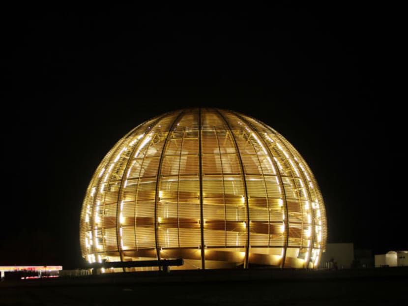 In this 2010 file picture the globe of the European Organization for Nuclear Research, CERN, is illuminated outside Geneva, Switzerland. Photo: AP