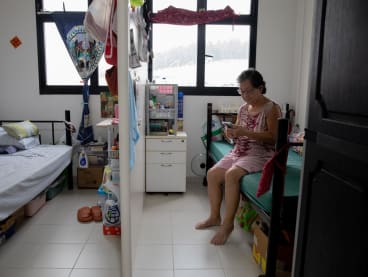 Ms Doreen Chan in her flat under the Joint Singles Scheme Operator-Run pilot, on March 24, 2023. To provide more privacy, HDB has been building new one-room rental flats with partitions, including some that have internal doors to separate the sleeping areas.