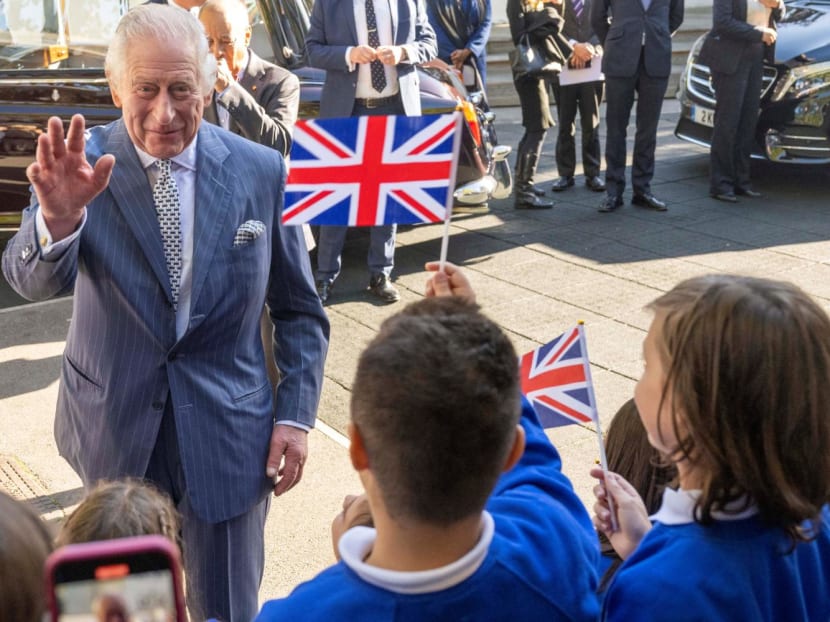 Britain's King Charles III is welcomed as he arrives to meet with members and staff of the association "Project Zero", an organisation dedicated to engaging young people in positive activities, promoting social inclusion and strengthening community cohesion, during a visit of the center in Walthamstow, in east London, on Oct18, 2022.
